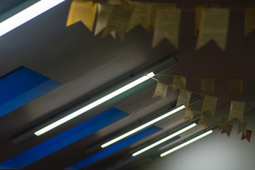 Row of fluorescent lamps of ceiling