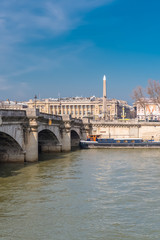 Naklejka premium Paris, the Concorde bridge, the obelisk in background, and houseboats on the Seine 