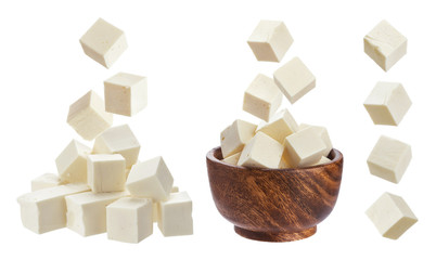 Feta isolated. Falling pieces of white cheese