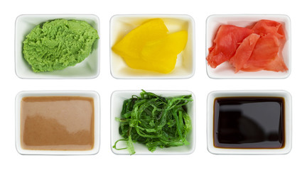 Japanese sushi spices. Soy sauce, wasabi, pickled ginger, chuka, sesame sauce and pickled radish...