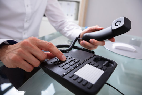 Businessman Calling On Landline