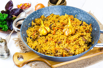 Preparation of pilaf with lamb in frying pan