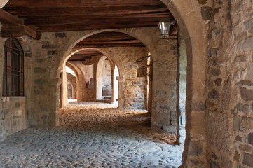 Fototapeta na wymiar Porticos along Via Mercatorum, Cornello dei Tasso, ancient medieval village, Camerata Cornello, Lombardy, Italy