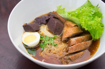 Duck meat noodle with boiled egg.