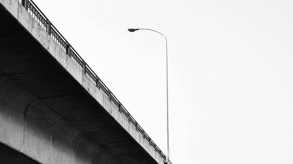 Lamp post street at concrete bridge in thailand - monochrome