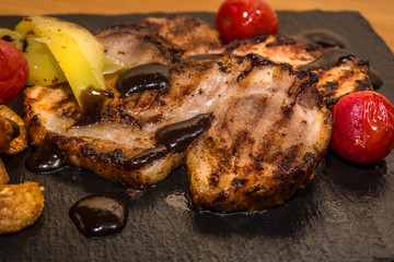 Delicious meat with vegetables, cooked on the grill. Fresh and juicy food
