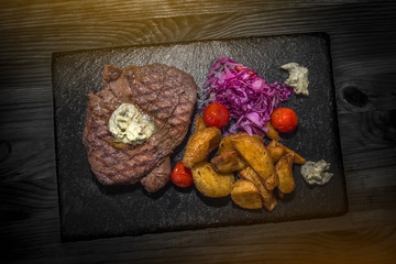 Delicious meat with vegetables, cooked on the grill. Fresh and juicy food