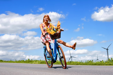 A carefree young woman is ecstatic about her new electric bicycle. She takes herself for a relaxing...