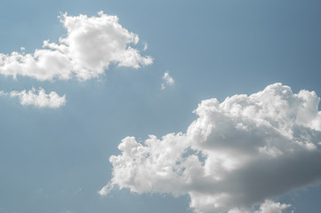 Obraz premium white clouds on blue sky at summer with sunshine