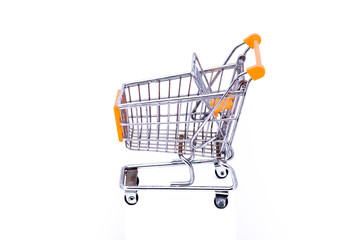 Miniature metal shopping cart with orange elements shot against a white background
