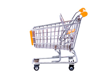 Miniature metal shopping cart with orange elements shot against a white background