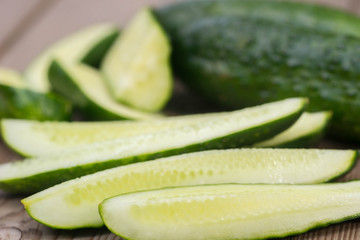 cucumber pieces on wooden board