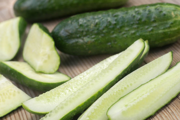cucumber pieces on wooden board