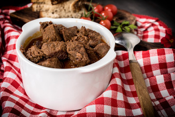 Beef meat stew in ceramic pot.