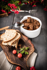 Beef meat stew in ceramic pot.