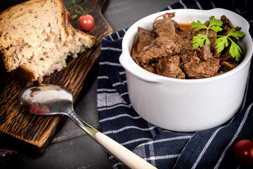 Beef meat stew in ceramic pot.