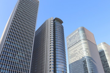Fototapeta na wymiar 大阪・中之島の高層ビル群／Skyscrapers in Nakanoshima - Osaka, Japan