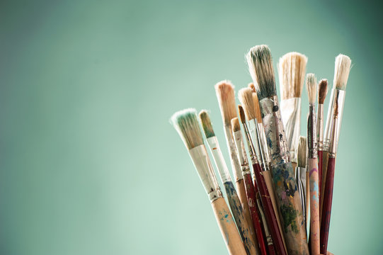 Close up of a mixes painting brushes