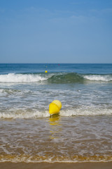 Fototapeta na wymiar Maritime signaling buoys at La Barrosa beach in Sancti Petri, Spain