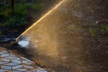 sprinkler installation in a field of park