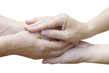 .Young female hands holding old female hands on a white isolated background.