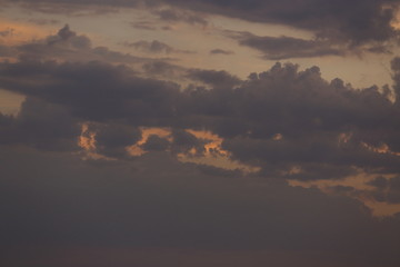 Beautiful sunset with clouds of orange and yellow in the ocean, the river