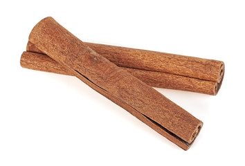 Pair of cinnamon sticks on a white background
