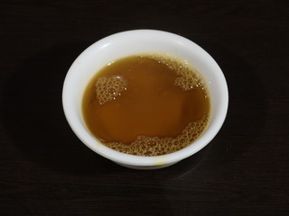 Indian Brown Mustard Seeds and oil,Yellow Mustard Seeds and oil,Close up of brown mustard seed,with its extracted oil on a brown wooden surface in dark Gothic colors.Its oil Boosts Cardiac Health,Bene