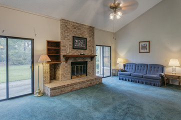 Simple living room in need of remodel.