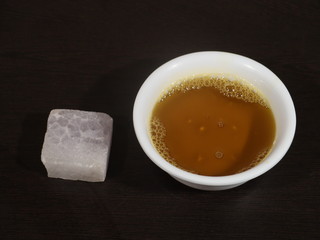 Mustard oil and Alum on Wooden Background, Fitkari, sarso ka tel