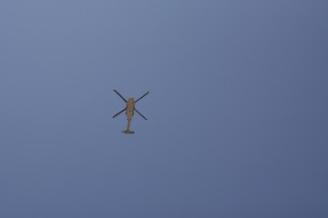Transport Helicopter flying against the blue sky