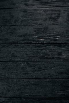 Old vintage wooden black background. Top view. Free space for your text.