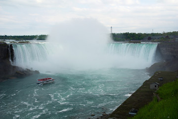 NIAGARA FALLS, ONTARIO, CANADA - MAY 20th 2018: Touristic boat on Horseshoe Falls, also known as Canadian Falls