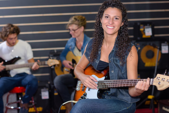 posing while playing the guitar