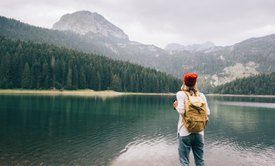 Travel woman with backpack girl enjoying nature