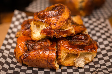 A close up of freshly baked cinnamon buns.
