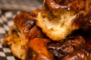A close up of freshly baked cinnamon buns.