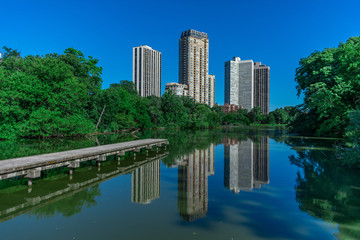 Fototapeta premium Side View of North Pond in Chicago with Building Reflections