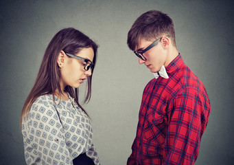 Sorrowful couple in front of each other