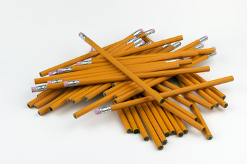 Jumbled stack of orange pencils