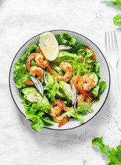 Prawns, avocado, garden herbs salad - delicious healthy snack, appetizers, tapas on a light...
