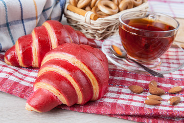 croissants with fruit glaze and another baking and a cup of tea