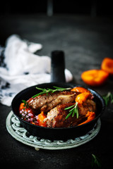 Duck breast with apricots . dark photo .style vintage