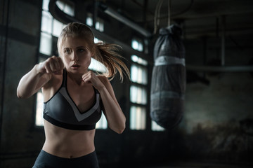 Female Boxer preparing for training in Boxing Club