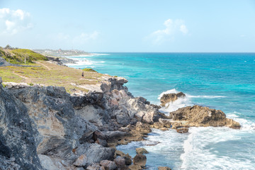 A man near a ocean-side cliff on Isla Mujeres.