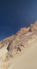 Beautiful white beach coast in jutland during bright daytime and blue sky. Rubjerg Knude Lighthouse, Lønstrup in North Jutland in Denmark, Skagerrak, North Sea