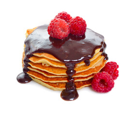 Pancakes with raspberries and chocolate sauce. Isolated on white background