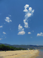 Huge cloudy step in the sky above the beach of camping 
