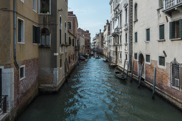 Fototapeta na wymiar The canal in Venice. Typically canals in Venice in Italy. Famous town of the canals and gondolas.