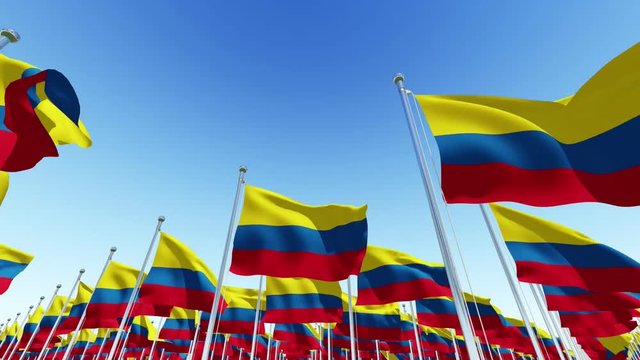 Many Columbia Flags blowing in the wind against blue sky in sunny day. Three dimensional rendering animation.